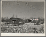 Chicken house and cattle barn, made of straw and wire, on William Helmke farm near Dickens, Iowa. The ninety acres and the crop share lease owned by a lawyer. All the buildings are of his own construction