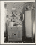 Washstand in house occupied by married hired hand and his wife. Harry Madsen farm near Dickens, Iowa. Three hundred sixty acres, owner-operated