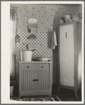 Washstand in house occupied by married hired hand and his wife. Harry Madsen farm near Dickens, Iowa. Three hundred sixty acres, owner-operated