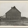 Barn of Lyle Askeland farm, six hundred forty acres near Armstrong, Iowa. Owned by loan company. Until recently it was owned by absentee estate. Barn received little or no attention over period of twenty years