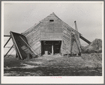 Corn crib on J.E. Herbrandson farm. One hundred sixty acres, owner-operated, near Estherville, Iowa. The necessity of making payments on a heavy mortgage has caused their buildings to be in bad repair