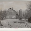 Barn and silo on H.H. Tripp farm near Dickens, Iowa. Two hundred acres. Rents from mother on crop share lease. These are very good buildings and in good repair