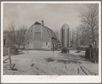 Barn and silo on H.H. Tripp farm near Dickens, Iowa. Two hundred acres. Rents from mother on crop share lease. These are very good buildings and in good repair