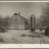 Barn and silo on H.H. Tripp farm near Dickens, Iowa. Two hundred acres. Rents from mother on crop share lease. These are very good buildings and in good repair