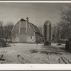 Barn and silo on H.H. Tripp farm near Dickens, Iowa. Two hundred acres. Rents from mother on crop share lease. These are very good buildings and in good repair