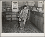 Farmer's wife churning butter. Emmet County, Iowa