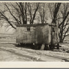 Trailer house owned by Clifford Blum. They lived in this for one year while he was farming eighty acres without buildings. [Near Terril, Iowa.]