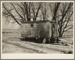 Trailer house owned by Clifford Blum. They lived in this for one year while he was farming eighty acres without buildings. [Near Terril, Iowa.]