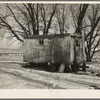 Trailer house owned by Clifford Blum. They lived in this for one year while he was farming eighty acres without buildings. [Near Terril, Iowa.]