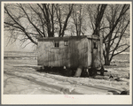 Trailer house owned by Clifford Blum. They lived in this for one year while he was farming eighty acres without buildings. [Near Terril, Iowa.]