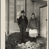 Edgar Allen and his wife at the rear of house on farm near Milford, Iowa