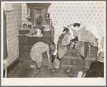 Corner of a bedroom on Edgar Allen farm near Milford, Iowa. There are piles of clothes and rags all over the house. An extreme case of poverty in northwestern Iowa. They are receiving aid from Resettlement Administration