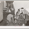 Corner of a bedroom on Edgar Allen farm near Milford, Iowa. There are piles of clothes and rags all over the house. An extreme case of poverty in northwestern Iowa. They are receiving aid from Resettlement Administration