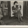 Wife of Homer Sharer and the baby, one of five children. Former tenant farmers and hired hands. They are now living on unemployment relief in Estherville, Iowa