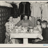 Marcus Miller and family in shack that he built himself. Spencer, Iowa. This is half the house. Miller is a hired hand who has managed to save enoughh to make a part payment on seven and a half acres of land