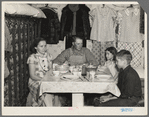 Marcus Miller and family in shack that he built himself. Spencer, Iowa. This is half the house. Miller is a hired hand who has managed to save enoughh to make a part payment on seven and a half acres of land