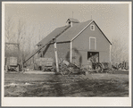 Corn crib on owner-operated farm of G.H. West near Estherville, Iowa. Note wealth of equipment