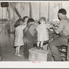 Christmas dinner in home of Earl Pauley. Near Smithfield [i.e. Smithland?], Iowa. Dinner consisted of potatoes, cabbage and pie