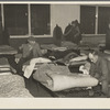 Men's dormitory at night at the homeless men's bureau, Sioux City, Iowa (for unattached men). Unemployment is the primary cause of their being here. This unemployment has been the direct cause of broken homes, through divorce and incompatibility