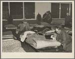 Men's dormitory at night at the homeless men's bureau, Sioux City, Iowa (for unattached men). Unemployment is the primary cause of their being here. This unemployment has been the direct cause of broken homes, through divorce and incompatibility