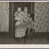 Mrs. Alfred Atkinson with baby and young child in farm home near Shannon City, Iowa. They rent eighty acres from an estate