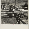 Turning the log at the country sawmill near Omaha, Illinois