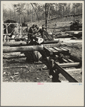 Turning the log at the country sawmill near Omaha, Illinois