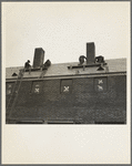 Men working on flashing of chimney. Greenhills, Ohio