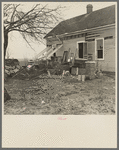 Furniture and debris scattered in Indiana farmyard after flood. Posey County, Indiana