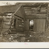 Log cabin farmhouse after the flood had swept through it. On Mackey Ferry Road near Mount Vernon, Indiana