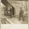 Removing tools from shed during moving operations of Everett Shoemaker, tenant farmer. Near Shadeland Indiana