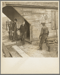 Removing tools from shed during moving operations of Everett Shoemaker, tenant farmer. Near Shadeland Indiana