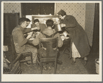 Everett Shoemaker and his wife serve lunch to the neighbors who helped them during moving operations. Near Shadeland, Indiana