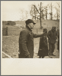 Frank Sheroan pleading for a better price on his livestock at closing-out sale. Near Montmorenci, Indiana