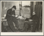 Settling up after the closing-out sale on Frank Sheroan's farm near Montmonenci, Indiana. Mr. Sheroan is shown with the clerk of the sale