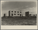 A group of houses at the Greenhills project. Ohio. These buildings have asbestos board siding