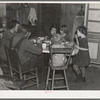 Oscar Gaither and family eating dinner. He is a tenant farmer near McLeansboro, Illinois