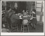 Oscar Gaither and family eating dinner. He is a tenant farmer near McLeansboro, Illinois