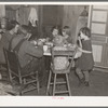 Oscar Gaither and family eating dinner. He is a tenant farmer near McLeansboro, Illinois