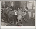 Oscar Gaither and family eating dinner. He is a tenant farmer near McLeansboro, Illinois