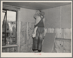 Installing wallboard in a house. Greenhills project, Ohio