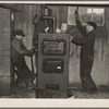 Plumbers at work in the basement of a house on the Greenhills project, Ohio