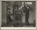 Plumbers at work in the basement of a house on the Greenhills project, Ohio