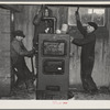 Plumbers at work in the basement of a house on the Greenhills project, Ohio