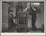 Plumbers at work in the basement of a house on the Greenhills project, Ohio