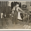 One of Erasty Emvich's sons weaving a rug in farmhouse near Battle Ground, Indiana. Mr. Emvich, tenant farmer and father of twelve children, also weaves in his spare time