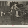 One of Erasty Emvich's sons weaving a rug in farmhouse near Battle Ground, Indiana. Mr. Emvich, tenant farmer and father of twelve children, also weaves in his spare time