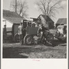 Charles Miller, for twelve years a hired farm hand, moving his household goods onto the farm he has now rented to work for himself. Northeast of Fowler, Indiana