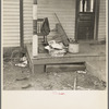 Backporch of Charles Miller's farmhouse during moving operations. Miller, for twelve years a hired farmhand, has now rented a farm to work for himself near Fowler, Indiana