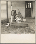 Backporch of Charles Miller's farmhouse during moving operations. Miller, for twelve years a hired farmhand, has now rented a farm to work for himself near Fowler, Indiana